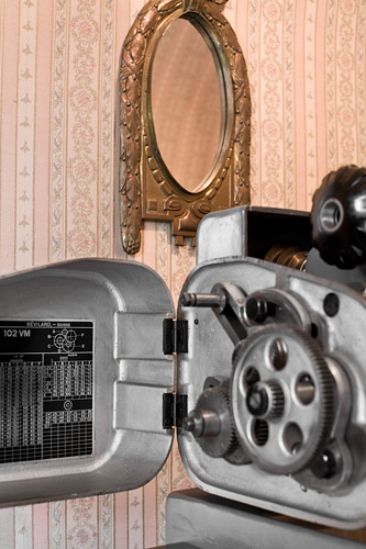 Precision lathe standing in Beat Haldimann's hallway, still life with mirror