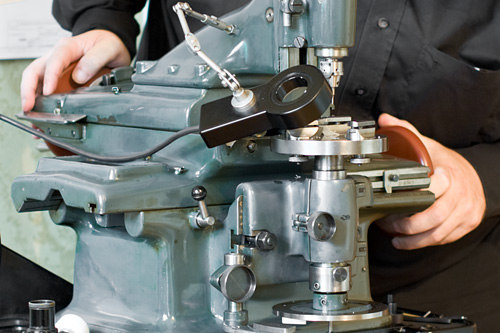 Beat demonstrating the use of the jig boring machine