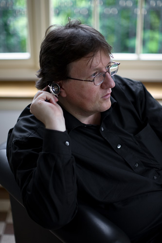 Beat Haldimann holding his central tourbillon watch H8 to his ear in order to listen to the song of his tourbillon